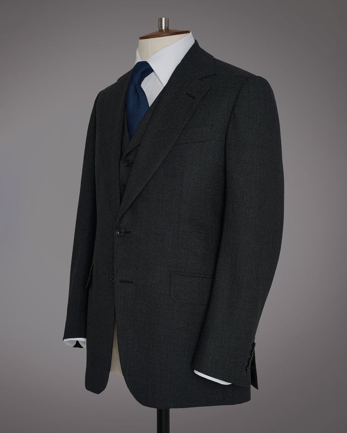G&H House cut three piece Lounge suit. Made up in a textured, mid grey high t...